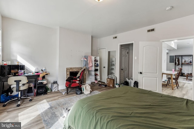 bedroom with light hardwood / wood-style flooring