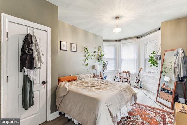 bedroom featuring hardwood / wood-style flooring and a closet