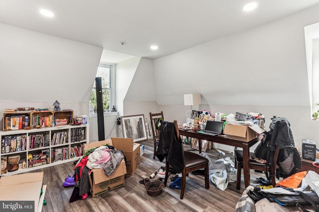 home office featuring hardwood / wood-style flooring and vaulted ceiling