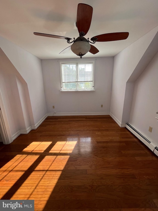 spare room with hardwood / wood-style flooring and ceiling fan