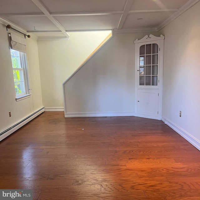 spare room featuring crown molding, wood-type flooring, coffered ceiling, and a baseboard radiator