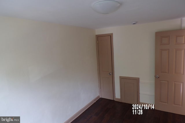 empty room featuring dark hardwood / wood-style floors