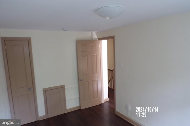 spare room featuring dark hardwood / wood-style floors