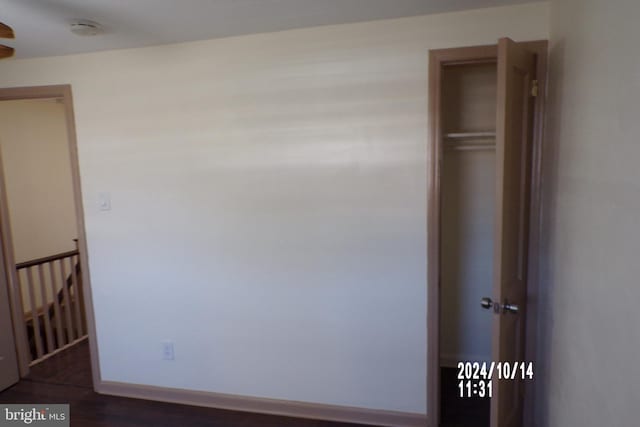 interior space featuring a closet and dark hardwood / wood-style floors