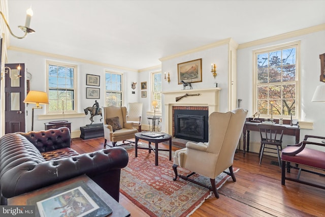 living room with hardwood / wood-style flooring and ornamental molding