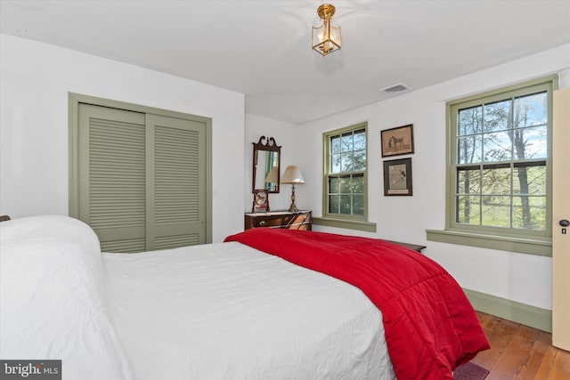 bedroom featuring a closet and hardwood / wood-style flooring