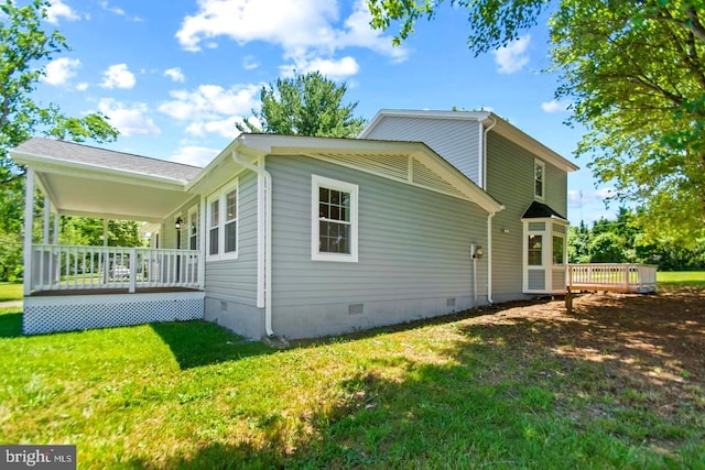 view of property exterior featuring a deck and a yard