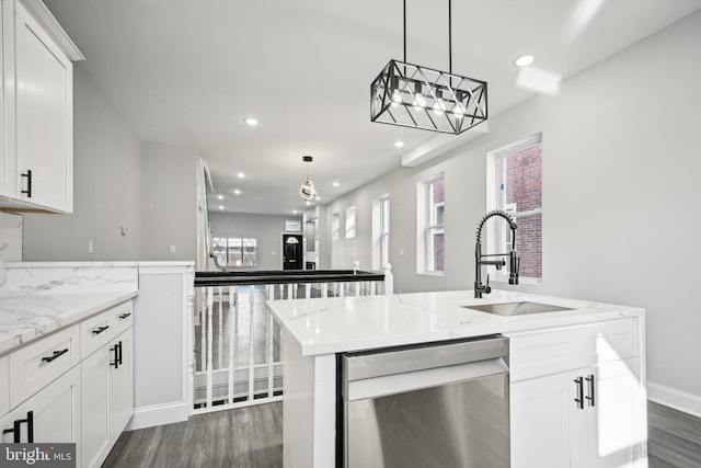 kitchen with white cabinets, dishwasher, plenty of natural light, and sink