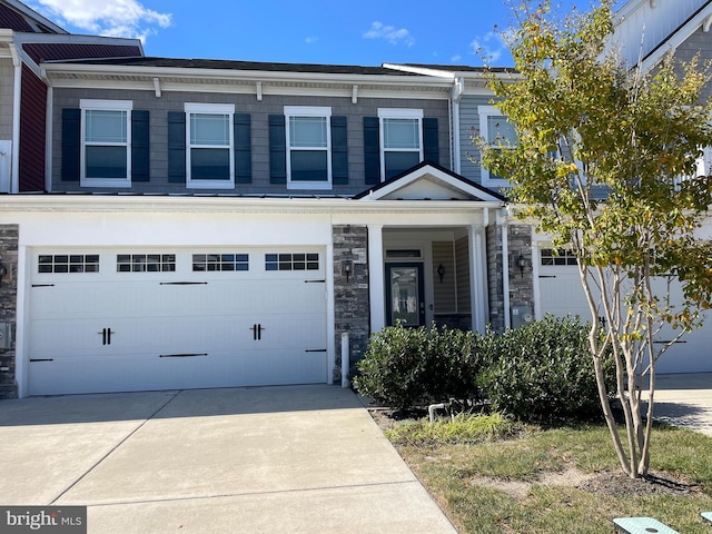 multi unit property featuring a garage