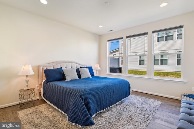 bedroom with hardwood / wood-style flooring