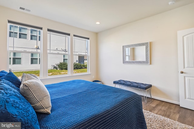 bedroom with hardwood / wood-style floors