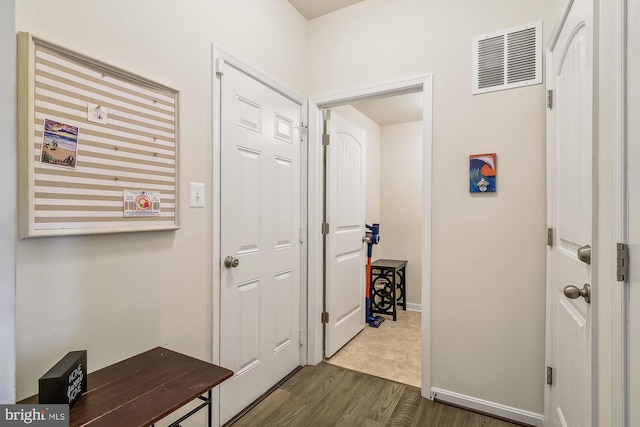 corridor with dark hardwood / wood-style floors