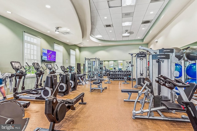 exercise room with a paneled ceiling