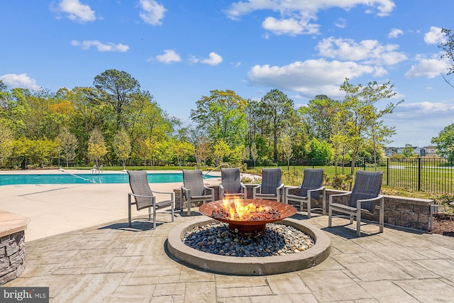 view of patio with an outdoor fire pit