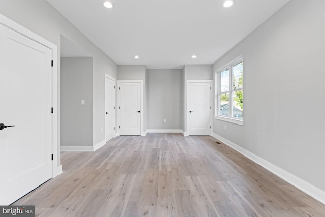 spare room featuring light wood-type flooring