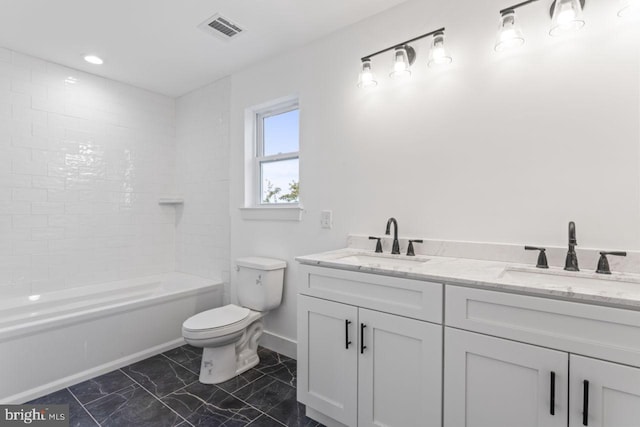 full bathroom featuring vanity, toilet, and tiled shower / bath