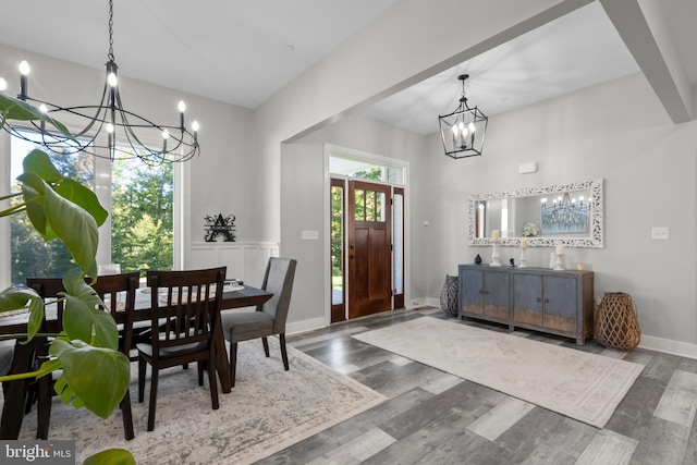 dining room featuring wood-type flooring and a chandelier