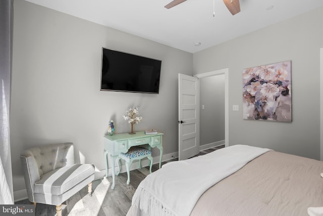 bedroom with hardwood / wood-style flooring and ceiling fan