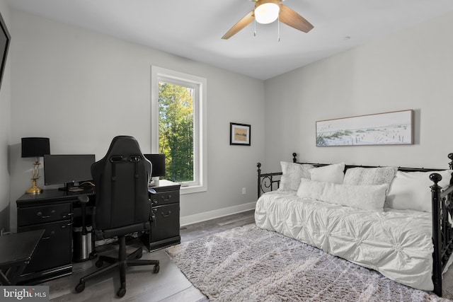 bedroom with hardwood / wood-style flooring and ceiling fan