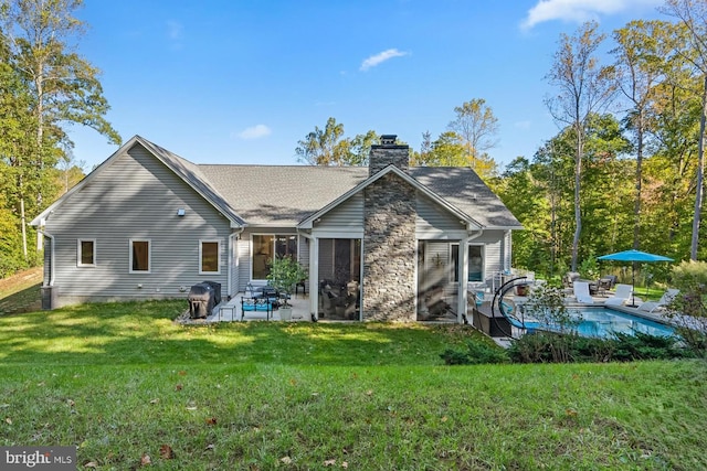 back of house with a yard, a patio area, and central AC unit