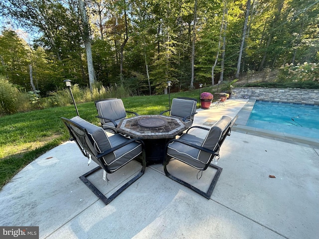 view of patio with a fire pit