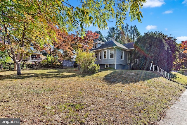 view of property exterior with a lawn