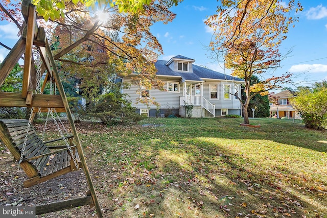 rear view of house with a lawn