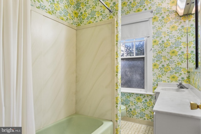 full bathroom featuring vanity, shower / bath combo with shower curtain, toilet, and tile patterned flooring