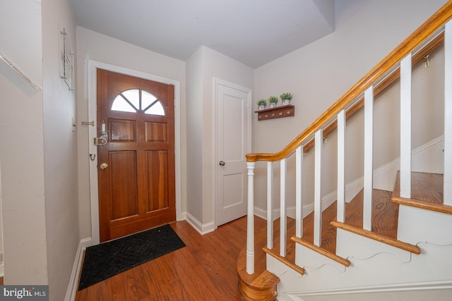 foyer entrance with hardwood / wood-style flooring