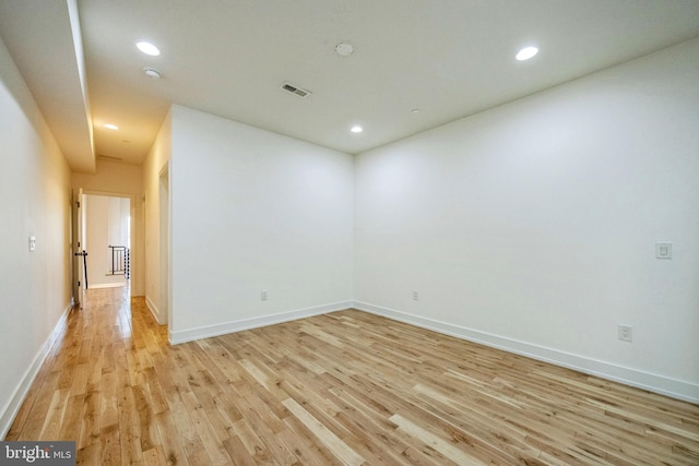 spare room with light hardwood / wood-style floors