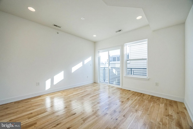 unfurnished room featuring light hardwood / wood-style floors