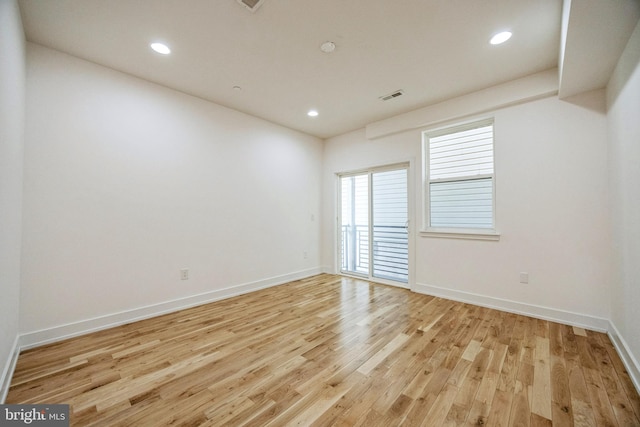 unfurnished room featuring light wood-type flooring