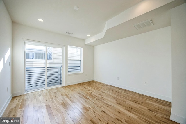 spare room with light wood-type flooring