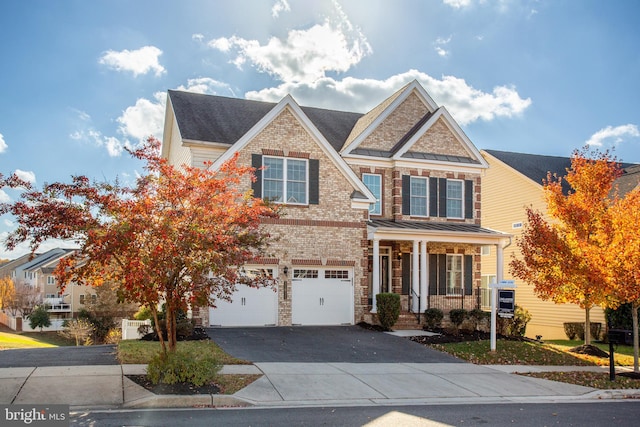 11011 Flying Change Ct, Upper Marlboro, MD 20772 - view of front of property featuring a porch, driveway, an attached garage, and brick siding