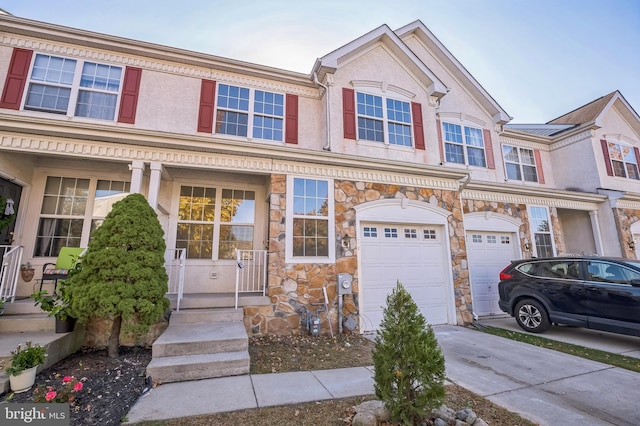 townhome / multi-family property featuring a garage