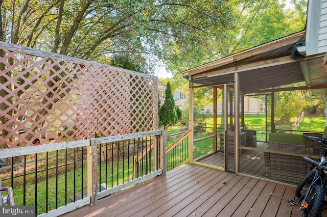 wooden terrace with a yard