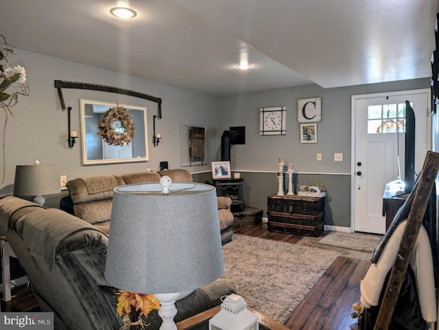 48 W 3rd St, Everett, PA 15537 - living area with wood finished floors and a wood stove