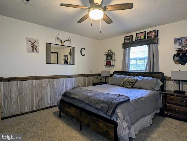 48 W 3rd St, Everett, PA 15537 - bedroom featuring carpet floors, a textured ceiling, wainscoting, and ceiling fan