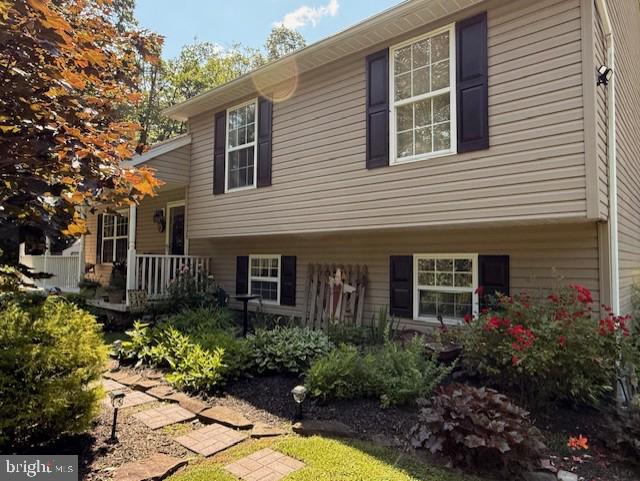 48 W 3rd St, Everett, PA 15537 - view of side of home featuring covered porch