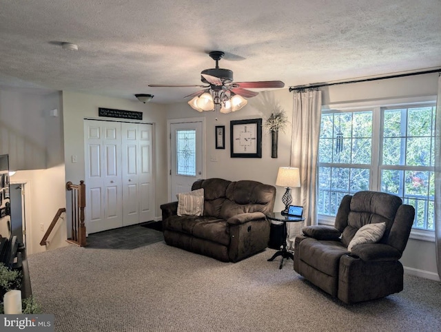 48 W 3rd St, Everett, PA 15537 - carpeted living room featuring a textured ceiling, healthy amount of natural light, and ceiling fan