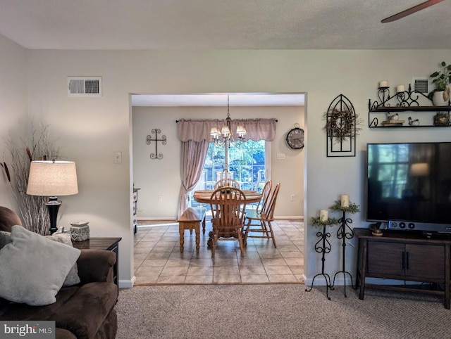 48 W 3rd St, Everett, PA 15537 - dining space with a chandelier, carpet floors, and tile patterned floors
