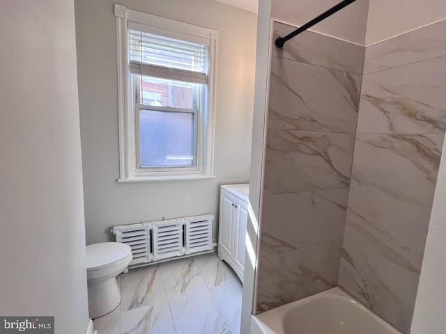 full bathroom featuring vanity, toilet, and tiled shower / bath