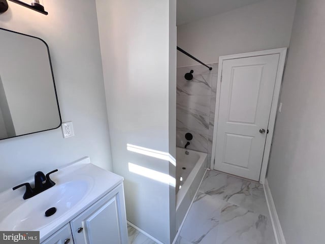 bathroom with vanity and tiled shower / bath combo