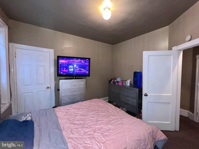 bedroom with carpet and vaulted ceiling