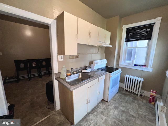 kitchen featuring electric range, radiator heating unit, sink, backsplash, and white cabinets