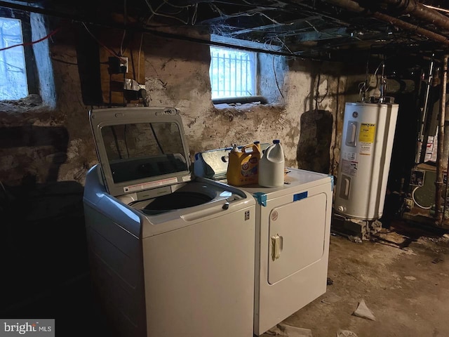 washroom with separate washer and dryer and water heater