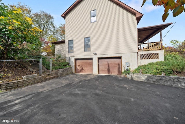 view of property exterior featuring a garage