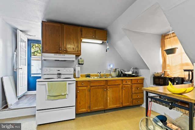 kitchen with white electric range oven, sink, vaulted ceiling, and light colored carpet