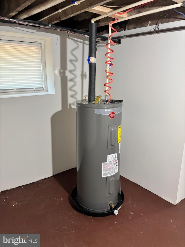 utility room featuring electric water heater