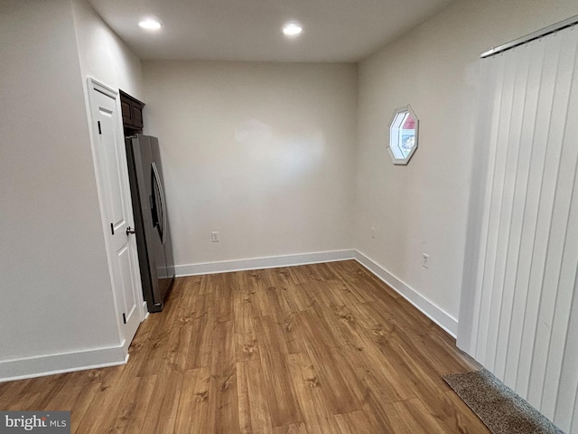 spare room with light wood-type flooring